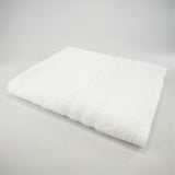 Drap de bain blanc en éponge bouclette, 100 % coton doux et ultra-absorbant , idéal pour un séchage rapide et confortable au quotidien.