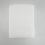 Drap de douche blanc en éponge bouclette, doux et ultra-absorbant , idéal pour un séchage rapide et confortable au quotidien.
