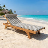 matelas de plage « Bahia » taupe 60x180 avec coussin intégré et bandoulière, assorti à sa serviette de plage coordonnée.