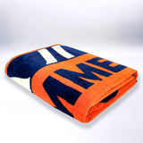 serviette de plage zamani XL éponge velours Jacquard orange 140x180 cm 400g/m² douce, absorbante et idéale pour plage et piscine.