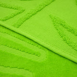 zoom serviette de plage éponge velours jacquard unie ciselés klang vert 90x170 340g/m² douce et absorbante, idéale piscine, plage ou salle de bain.
