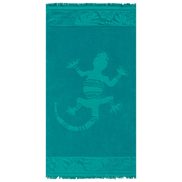 Serviette de plage ciselée Kariba en velours jacquard bleu, motif gekko et franges aux extrémités.