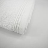 Serviette invité blanche en éponge bouclette, 100% coton douce et ultra-absorbante, 30x50 cm, idéale pour un séchage rapide et élégant.