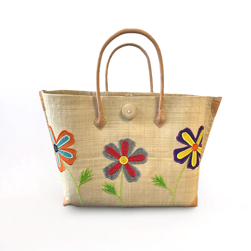 Panier artisanal malgache Isandra SGM en fibres naturelles, aravoula tressé, brodé, solide et élégant pour plage ou ville.