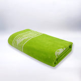 serviette de plage éponge velours jacquard cosmo vert 90x170cm douce, absorbante et élégante, parfaite pour plage et piscine.