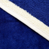 zoom serviette de plage éponge velours jacquard kapados bleu 100x175 470g/m² douce et absorbante, parfaite pour plage, piscine ou sport.