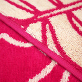 zoom serviette de plage éponge velours Jacquard Colca Rose 90x170 cm 400g/m²,  douce et absorbante, idéale piscine, plage ou salle de bain.