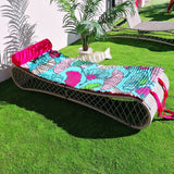 matelas de  plage Ginkos fond turquoise avec motifs ginkos avec oreiller intégré et anse bandoulière 